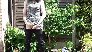 Sexy masturbating crossdresser in thigh boots outdoors
