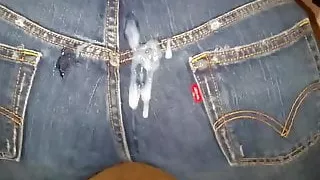 Releasing a load of cum on her jeans