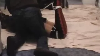 Kathy hogtied and struggling