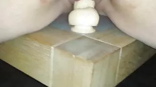 Riding a dildo
