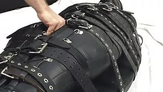 Bound in leather and made to cum