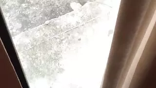 Hotel window squirting in the morning