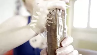 Candy May - Gives handjob to BBC with a latex glove