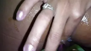 Filipina cramming fingers up her asshole