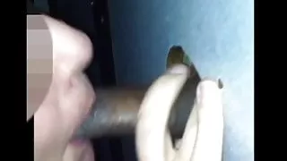 Slut wife sucking black cock at gloryhole