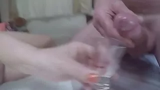 Wife catching cum in shot glass