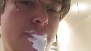 Young guy takes hot facial and spits it back out