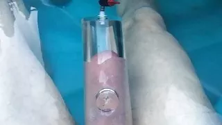 Pumping cock foreskin and balls in hot tub