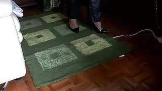 Walking with high heel pumps and leather trouses.