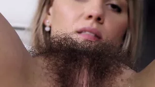 Jehanna strips naked and fingers her hairy pussy
