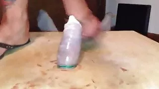 Trampling his poor cock in a condom