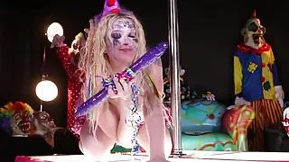Clown Leya Falcon plays with a big purple dildo