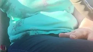 Furry kitty plays and squirts in car in parking lot