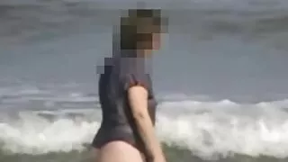 Wife wearing a see-thru top in the surf at Studland.