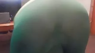 in green showing off in living room