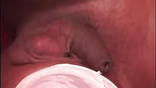 Ebony beauty poses on the couch in white lingerie and wanks