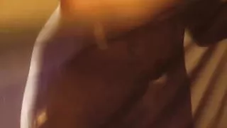 A sexy stripteasing dance of a brunette MILF.