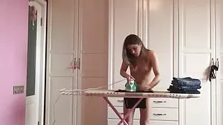 Ironing the kinky clothes while completely naked
