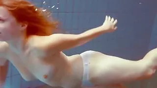Cute Melissa plays underwater