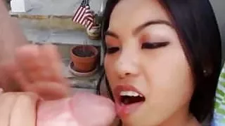 Asian babe stroking dick by the pool