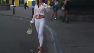 hooker walking in the street in sexy high heels and legging