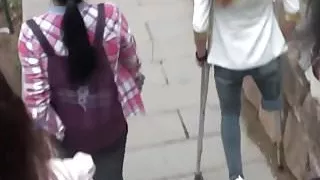 Amputee Chinese Girl Down Stairs With Crutches