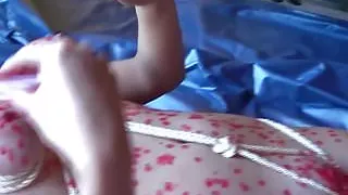 Hot waxing her rope bondaged body and pussy