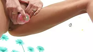 British gilf Dolly pushes a dildo up her fanny