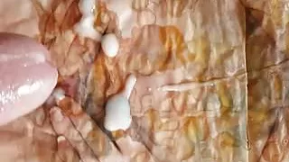 Wanking and cumming over a very messy shared porn mag