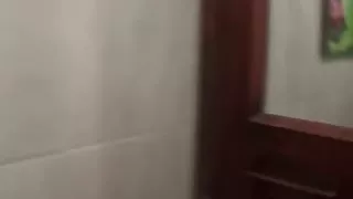 Sexy brunette Asian babe fools around with the camera