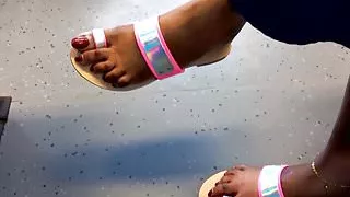 black mature feet with long red toenails and feet show