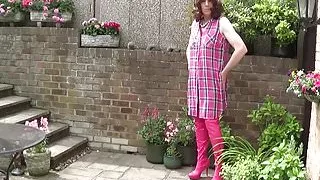 In chastity wearing Hot Pink Thigh Boots
