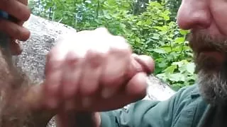 Older guy has fun sucking a younger guys cock in the park