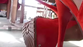 teasing with orange platform heels