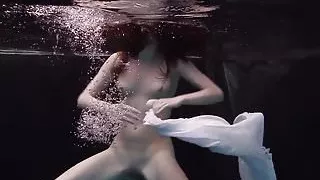 Redhead beauty in the white dress