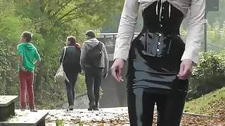 Lady black latex skirt outdoor