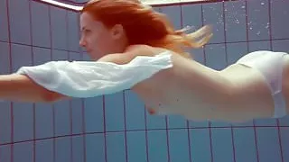 Redhead in a white dress and sexy bikini