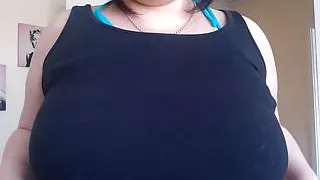 Squeezing her big tits