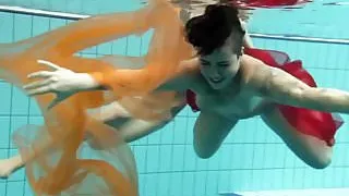 Two underwater girls loving eachother