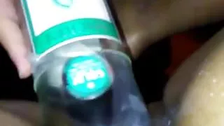 Black amateur gets fucked with a bottle
