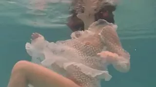 White moth in a dress underwater