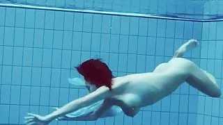 Hot teen unterwasser swims and strips