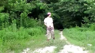 Cute straight guy Sean Johansen works on his dick in nature