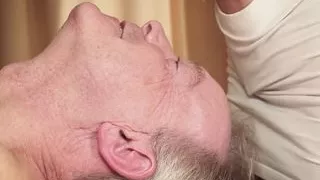 Old man gets oil massage from two beautiful teen girls
