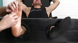 Bound jock giggles while being tickled  by two horny gay men