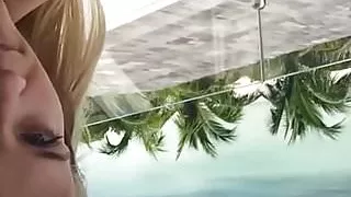 Reese Witherspoon on balcony in bikini top