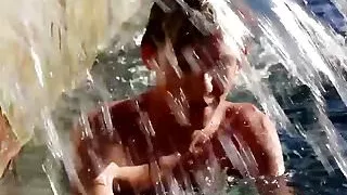 Blonde twink Tyler Thayer jerking his cock near the pool