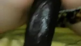 Riding black dildo