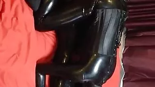 latex girl tied on bed