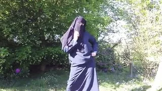 Muslim in burqa and stockings – flashing outdoors